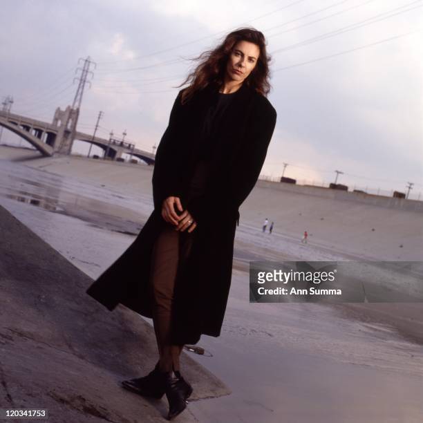 Director Kathryn Bigelow poses for a portrait session in the LA River and under the 6th St. Bridge on January 1, 1989 in Los Angeles, California.