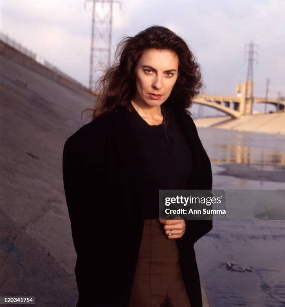 Director Kathryn Bigelow poses for a portrait session in the LA River and under the 6th St. Bridge on January 1, 1989 in Los Angeles, California.