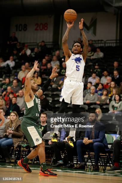 February 25: Delaware Blue Coats guard Xavier Munford shoot over the defends of Wisconsin Herd guard Frank Mason in a NBA G-League game on Tuesday...