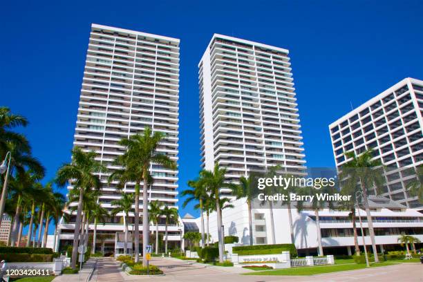 twin-tower condominium properties, called trump plaza, located along the intracoastal waterway in west palm beach - trump plaza palm beach stock pictures, royalty-free photos & images