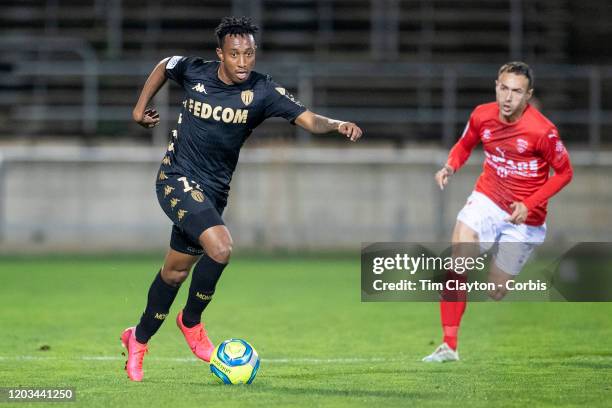 February 01: Gelson Martins of Monaco chased by Romain Philippoteaux of Nimes during the Nimes V Monaco, French Ligue 1, regular season match at...