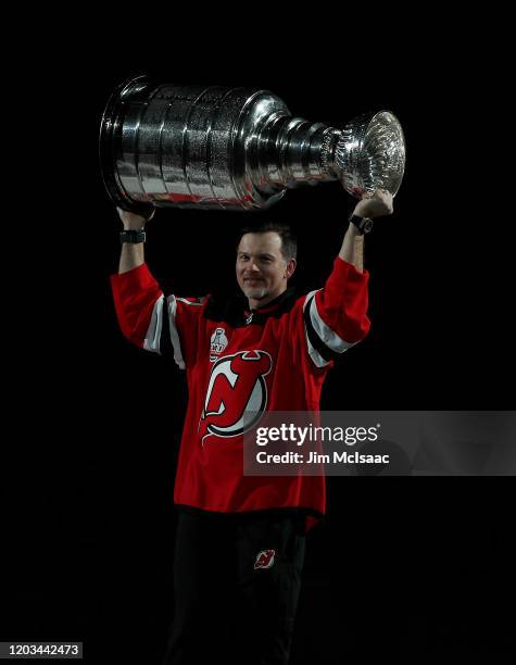 Former New Jersey Devil Petr Sykora skates with the Stanley Cup during the teams celebration of its 1999-2000 Championship prior to the start of a...