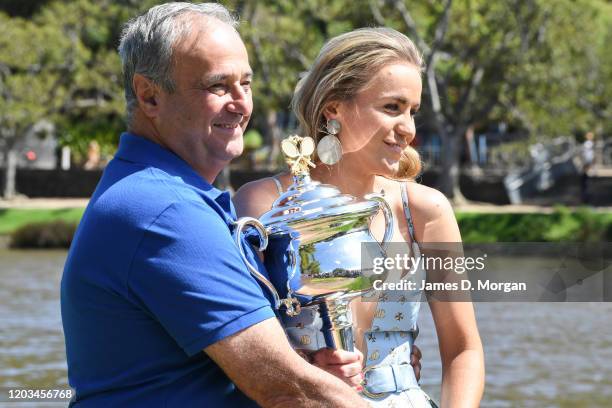 Sofia Kenin of the United States poses next to her father, Alex Kenin with the Daphne Akhurst Memorial Trophy beside the Yarra River after winning...