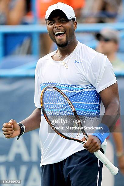 Donald Young celebrates match point against Michael Russell during the Legg Mason Tennis Classic presented by Geico at the William H.G. FitzGerald...