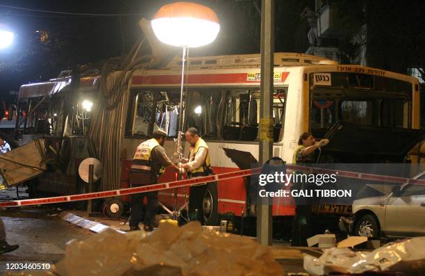 Israeli paramedics sarch the bus in which a suicide bomber blew himself up in the Jewish neighborhood of Shmuel Hanavi close to to east Jerusalem 19...