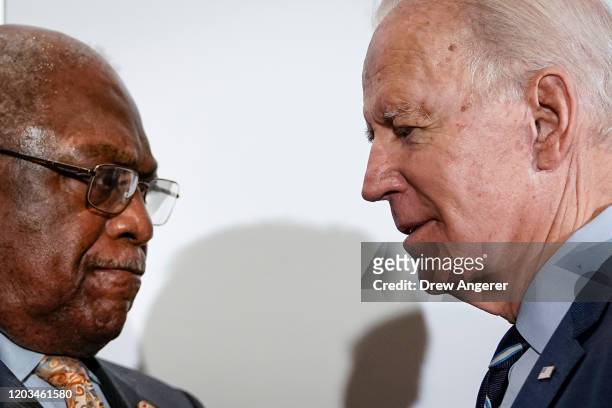 Rep. And House Majority Whip James Clyburn and Democratic presidential candidate former Vice President Joe Biden pauses speaks briefly with each...