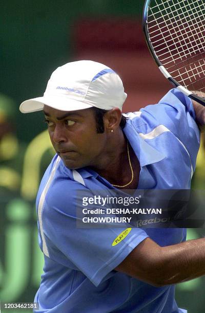 Indian tennis player Leander Paes eyes the ball during his singles Davis Cup match against Mark Nielsen of New Zealand in Calcutta, 04 April 2003....