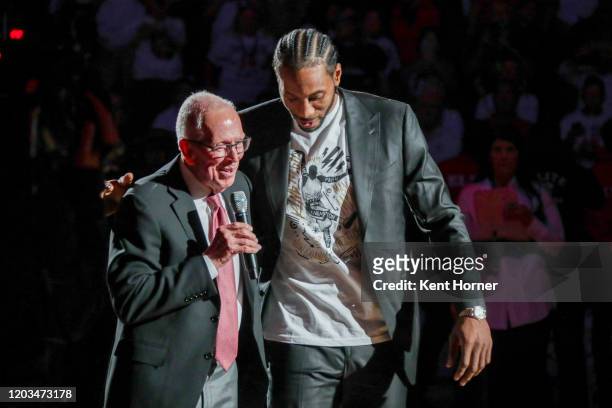 San Diego State Alumni Kawhi Leonard participates in his jersey retirement ceremony with former college coach Steve Fisher during half time of the...