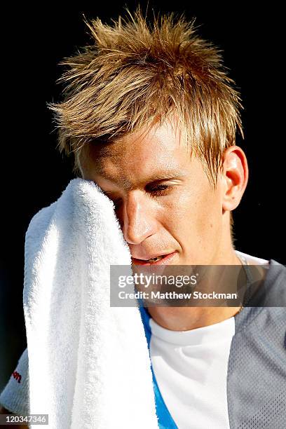 Jarkko Nieminen of Finland towels off between games while playing Radek Stepanek of the Czech Republic during the Legg Mason Tennis Classic presented...