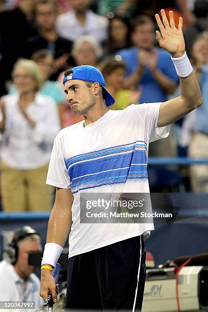 John Isner acknowledges the crowd after his win over James Blake during the Legg Mason Tennis Classic presented by Geico at the William H.G....