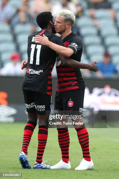 Nicolai Muller of Western Sydney Wanderers celebrates scoring a goal with team mate Bruce Kamau during the round 17 A-League match between the...