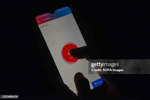 In this photo illustration, a Kashmiri man connects VPN on his phone to unblock access to social media sites in Srinagar. Authorities in Jammu and...