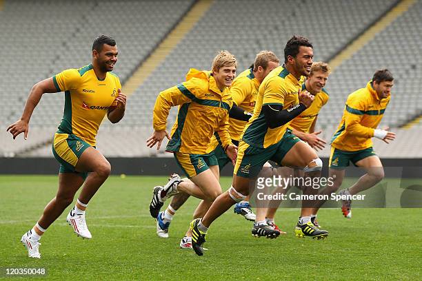 Digby Ioane of the Wallabies leads team mates in a sprint during an Australian Wallabies Captain's Run at Eden Park on August 5, 2011 in Auckland,...