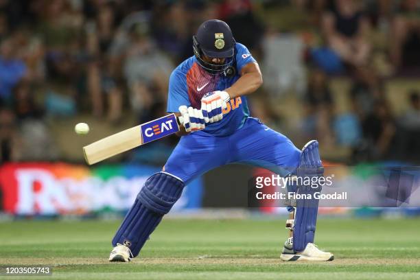 India Captain Rohit Sharma takes a shot during game five of the Twenty20 series between New Zealand and India at Bay Oval on February 02, 2020 in...