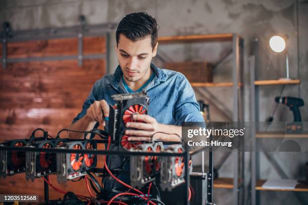 installing gear for mining bitcoin - electronic trading stock pictures, royalty-free photos & images