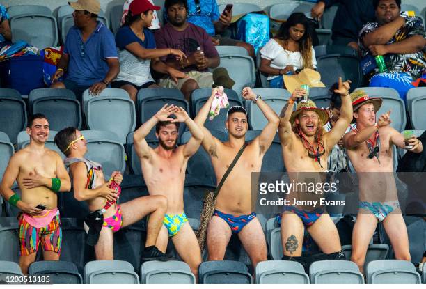 People are seen dancing in the rain as play is delayed due to weather conditions at the 2020 Sydney Sevens at Bankwest Stadium on February 02, 2020...