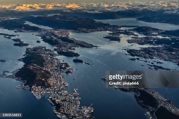 passenger view from an airplane over the fjords of norway, the city of alesund - aalesund stock pictures, royalty-free photos & images