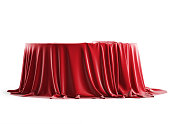 Round podium covered with red silk cloth. Isolated on a white background with clipping path.