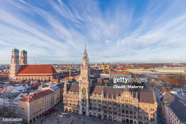 marienplatz in munich with new town hall and frauenkirche. panoramic wide angle. skyline munich old town. - marienplatz stock-fotos und bilder