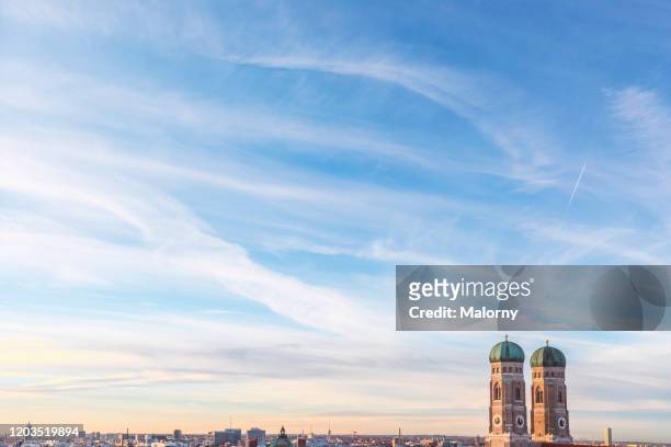 close-up of the bell towers of the frauenkirche at marienplatz in munich. panoramic skyline. - munich landmark stock pictures, royalty-free photos & images