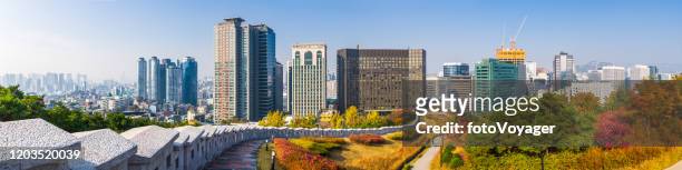 seoul city walls overlooked by downtown skycraper cityscape panorama korea - gangnam seoul stock pictures, royalty-free photos & images