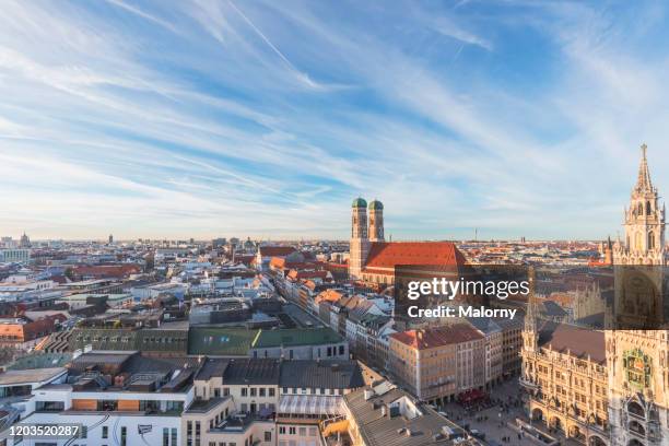 view over munich. munich skyline with marienplatz in munich with old town hall and frauenkirche. - munich stockfoto's en -beelden