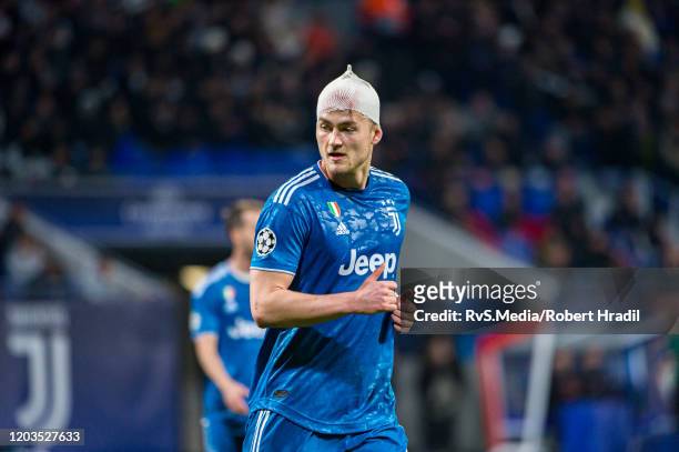 Matthijs de Ligt of Juventus in action with bandages on his head after minor injury during the UEFA Champions League round of 16 first leg match...