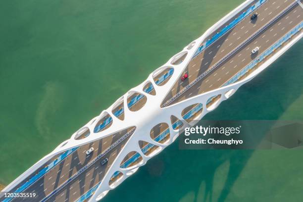 modern bridge with strange structures, qingdao city,shandong province,china - qingdao bridge stock pictures, royalty-free photos & images