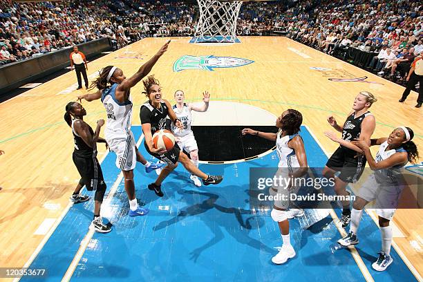 Becky Hammon of the San Antonio Silver Stars goes for the basket against Rebekkah Brunson of the Minnesota Lynx during the game on August 4, 2011 at...