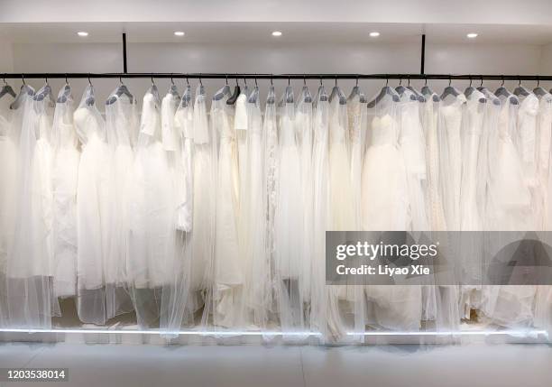 cloakroom - wedding dress on hanger stock pictures, royalty-free photos & images
