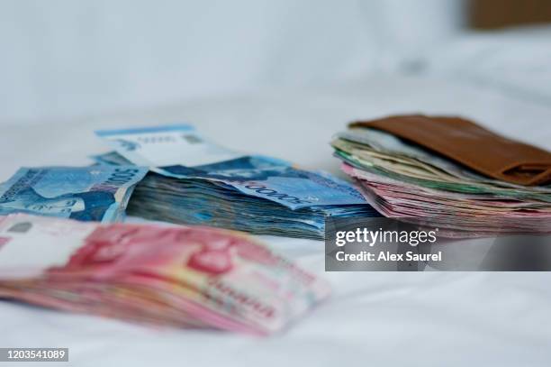 indonesian roupies - money laundering stock pictures, royalty-free photos & images