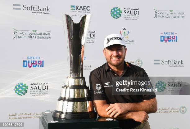 Graeme McDowell of Northern Ireland poses with the trophy during Day 4 of the Saudi International at Royal Greens Golf and Country Club on February...
