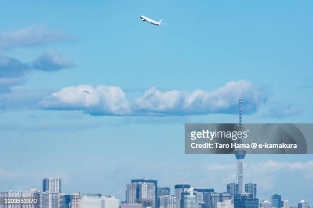 the airplane taking off the airport in tokyo of japan - haneda tokyo stock-fotos und bilder