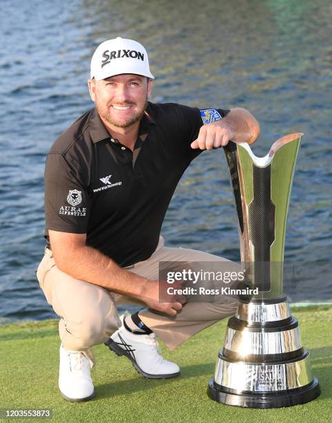 Graeme McDowell of Northern Ireland poses with the trophy during Day 4 of the Saudi International at Royal Greens Golf and Country Club on February...