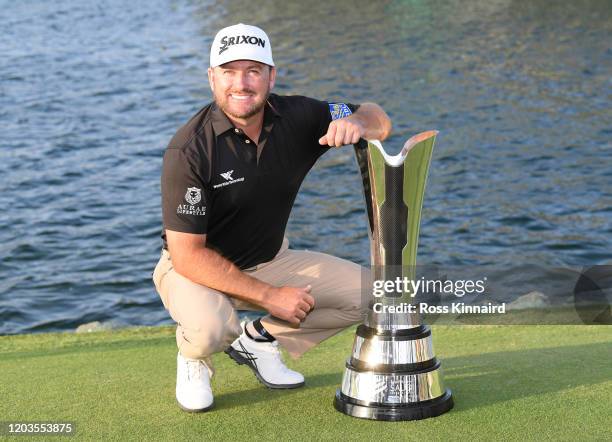 Graeme McDowell of Northern Ireland poses with the trophy during Day 4 of the Saudi International at Royal Greens Golf and Country Club on February...