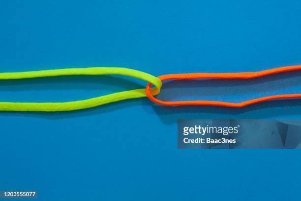 shoelaces tied up - lace fastener stock pictures, royalty-free photos & images