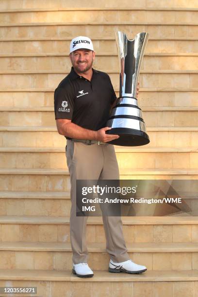 Graeme McDowell of Northern Ireland poses with the trophy during Day 4 of the Saudi International at Royal Greens Golf and Country Club on February...