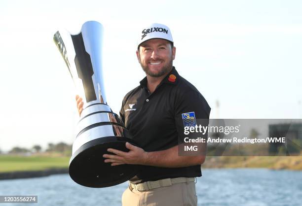 Graeme McDowell of Northern Ireland poses with the trophy during Day 4 of the Saudi International at Royal Greens Golf and Country Club on February...