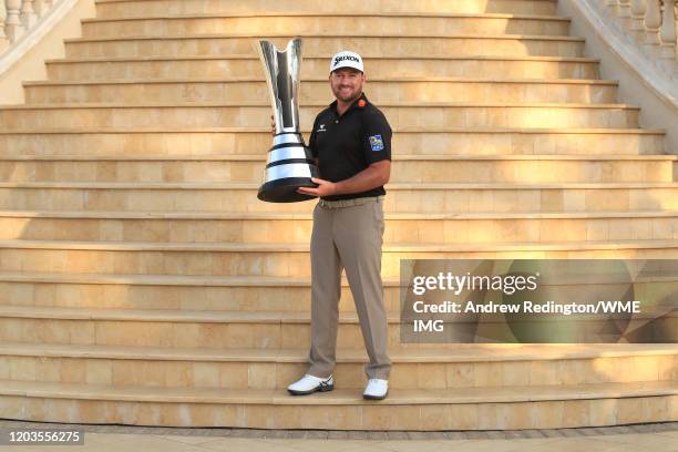 Graeme McDowell of Northern Ireland poses with the trophy during Day 4 of the Saudi International at Royal Greens Golf and Country Club on February...