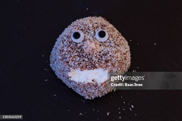 snowball (snacks) with googly eyes - snowball stock pictures, royalty-free photos & images