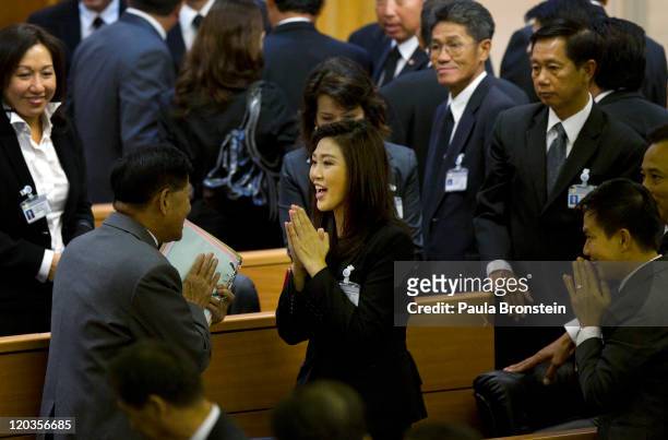 Yingluck Shinawatra reacts inside the chambers of the Parliament after the Thai parliament officially elected her as the country's first female Prime...