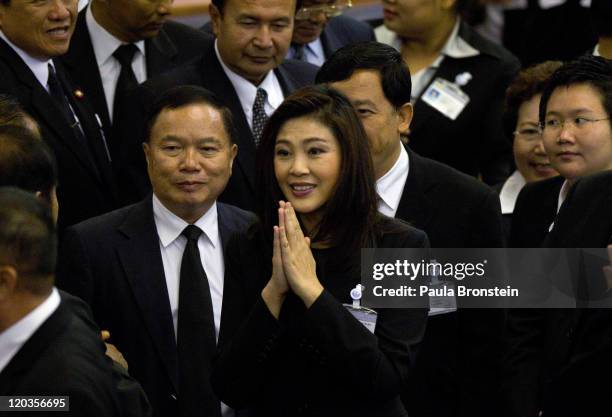 Yingluck Shinawatra reacts inside the chambers of the Parliament after the Thai parliament officially elected her as the country's first female Prime...