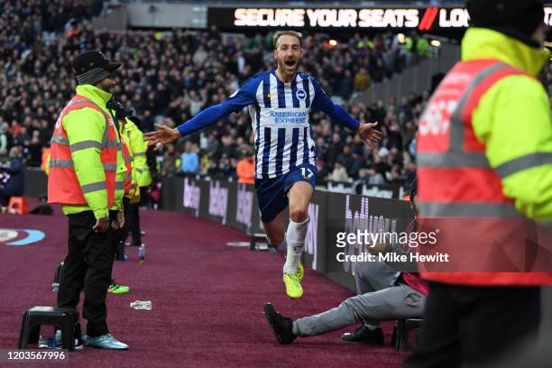 Glenn Murray of Brighton & Hove Albion dodges the stewards while celebrating his equaliser during the Premier League match between West Ham United...