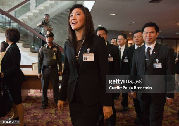 Yingluck Shinawatra greets the media after the Thai parliament officially elected her as the country's first female Prime Minister July 5, 2011 in...