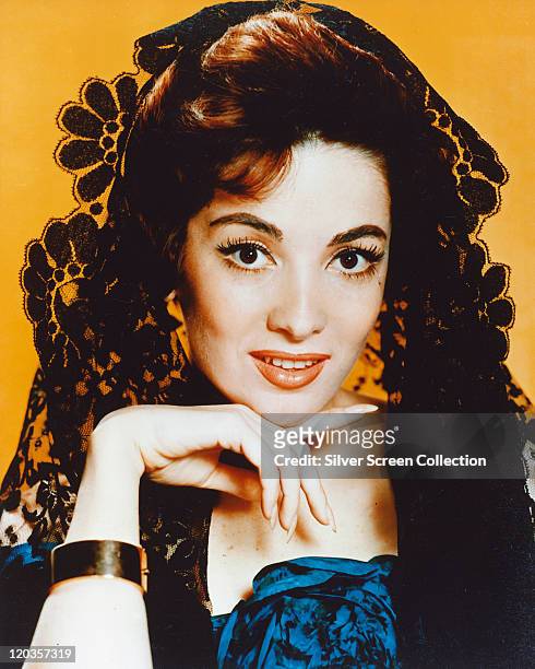 Headshot of Linda Cristal, Argentinian actress, wearing a black lace veil in a studio portrait issued as publicity for the US television series, 'The...