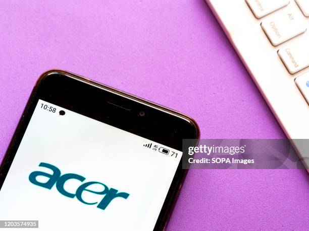 In this photo illustration the Acer logo is seen displayed on a smartphone.