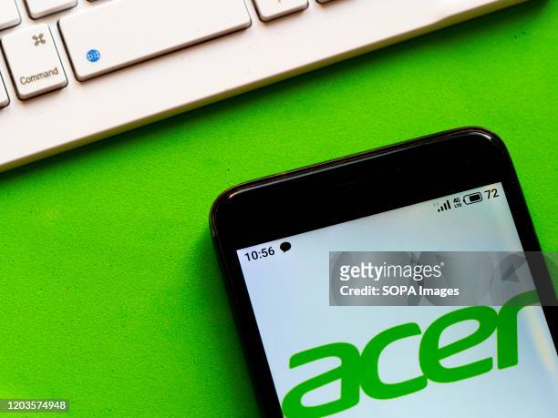 In this photo illustration the Acer logo is seen displayed on a smartphone.