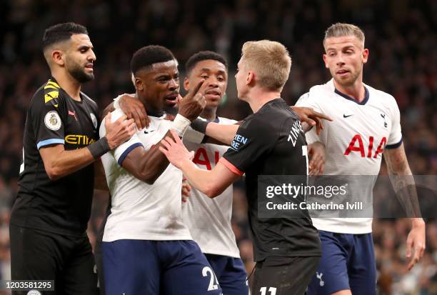 Serge Aurier of Tottenham Hotspur reacts to Oleksandr Zinchenko of Manchester City during the Premier League match between Tottenham Hotspur and...