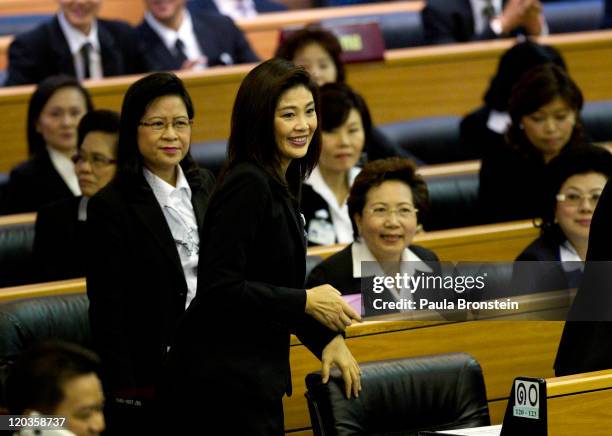 Yingluck Shinawatra reacts inside the chambers of the Parliament after the Thai parliament officially elected her as the country's first female Prime...