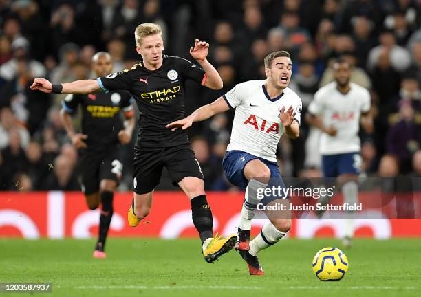 Oleksandr Zinchenko of Manchester City tackles Harry Winks of Tottenham Hotspur which leads to a second yellow card during the Premier League match...